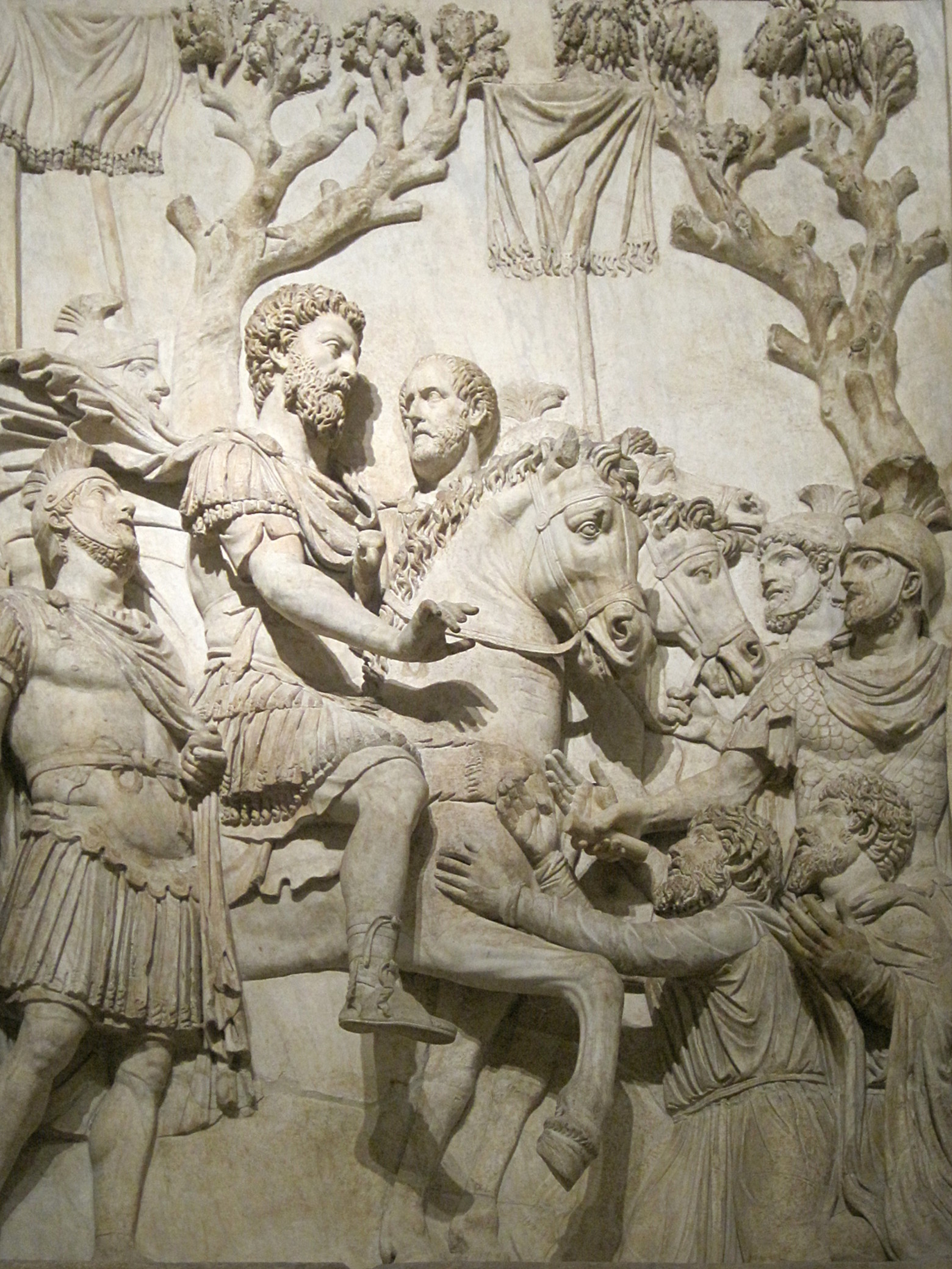Marcus Aurelius receiving the submission of the vanquished, with raised vexillum standards.